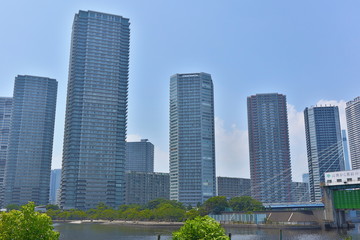 Naklejka premium High-Rise Tower Mansions with Blue Sky At Shinonome, Tokyo