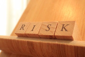 Wooden Block Text of Risk.