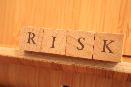 Wooden Block Text of Risk.