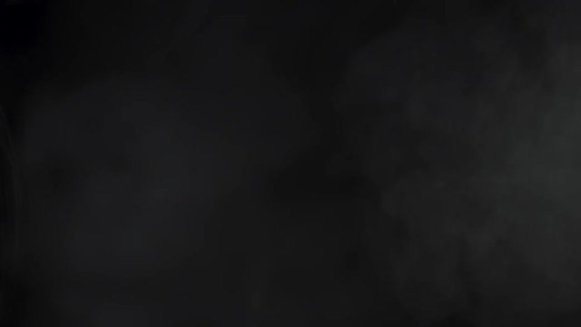 White smoke in front of black background