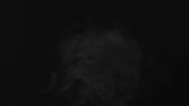 White smoke in front of black background