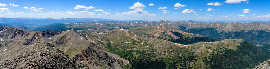 Fototapeta na wymiar Top of Mountains - A summer panoramic view of rolling mountain ridges and high peaks in Front Range of Colorado Rockies, seen from summit of Torreys Peak (14,267 ft). Colorado, USA.