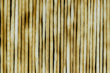 Group of baked italian bread sticks background on black background surface