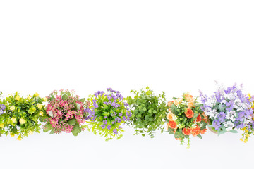 Plakat Rows of colorful fake flowers on white background, made from cloth and plastic for decoration
