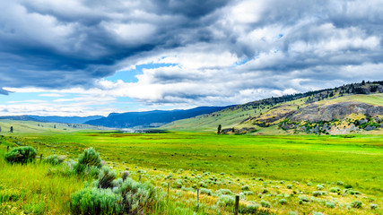 Dark Clouds hanging over the fertile farmland and rolling hills along Highway 5A near Nicola Lake, between Kamloops and Merritt in the Okanagen region of British Columbia, Canada