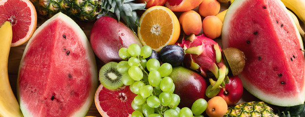 Naklejka na ściany i meble Healthy organic fruits background.