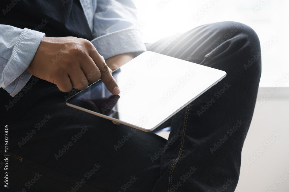 Poster digital tablet computer close up man using tablet hands man multitasking with isolated screen