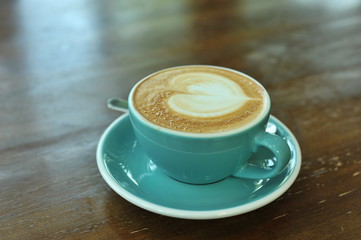 hot latte on wood table
