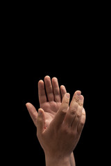 Fototapeta premium Clapping Hands on a Black Background with Copy Space