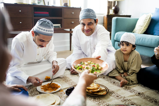 Muslim family having dinner on the floor