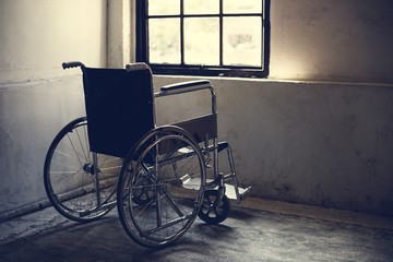 Fototapeta na wymiar Empty wheelchair in a room