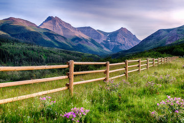 Fototapeta na wymiar Last Wooden Fence to Canadian Rocky Mountains
