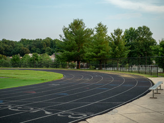 Unoccupied neighborhood track at evening hours, ready for offseason training 