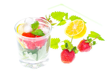 Fototapeta na wymiar Cold summer drink with strawberries, lemon and mint