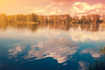 View of calm lake with the beautiful reflection in evening