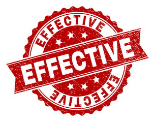 EFFECTIVE seal print with corroded texture. Rubber seal imitation has circle medallion shape and contains ribbon. Red vector rubber print of EFFECTIVE label with dust texture.