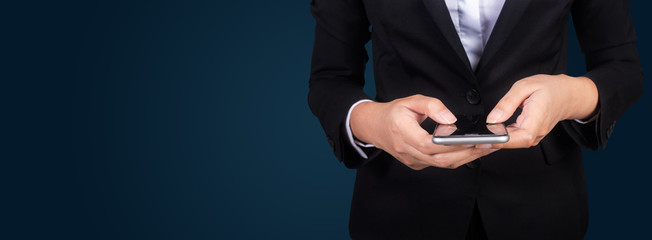 Portrait young businesswomen in black suit using smartphone, pretty hipster manager holding mobile gadget, girl smiletexting message, connect