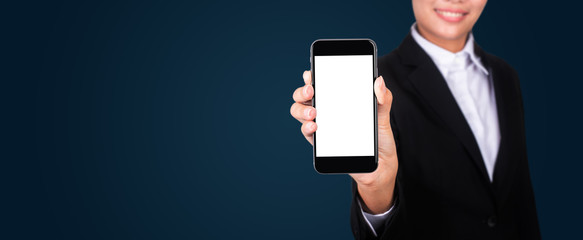 Happy young businesswoman showing blank smartphone screen.