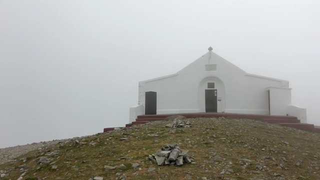 The church on top of Croagh Patrick in the mist.Croagh Patrick, is situated 8 kilometers south west of Westport town. The mountain's conical shape soars 2,510 feet majestically above Clew Bay, Ireland