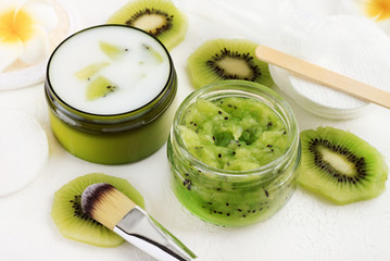 Homemade natural beauty care products from fresh green mashed kiwi and creamy yogurt. Facial treatment rich in vitamins for glowing complexion.