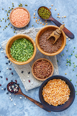 Green and yellow peas, mung and lentils in bowls.