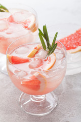 Citrus lemonade water with grapefruit sliced , healthy and detox water drink in summer on concrete table.