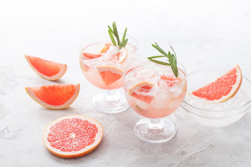 Citrus lemonade water with grapefruit sliced , healthy and detox water drink in summer on concrete table.