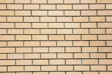 Yellow bricks in the wall as an abstract background