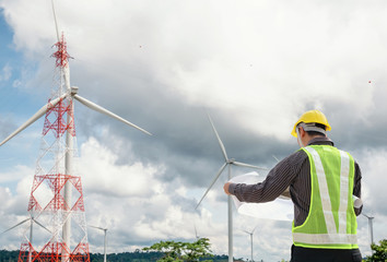 Engineer worker at wind turbine power station construction site