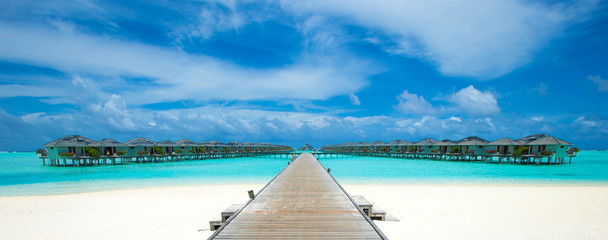 beach with water bungalows at Maldives
