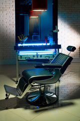 Hair clipper and brush for shaving beard on table in barber shop