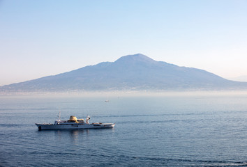  A cruise ship in the Gulf of Naples against the background of Mount Vesuvius. Sorrento, Italy