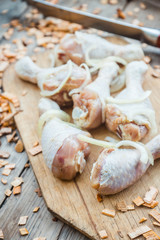 Raw chicken legs ready for grill. Selective focus.