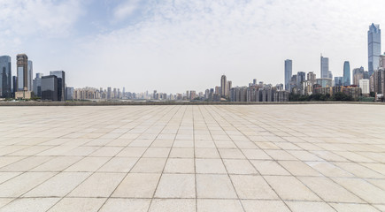 Fototapeta premium Panoramic skyline and modern business office buildings with empty road,empty concrete square floor
