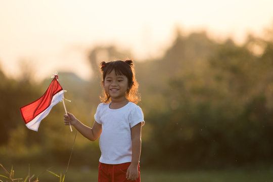 Kids Raising Indonesian Flag