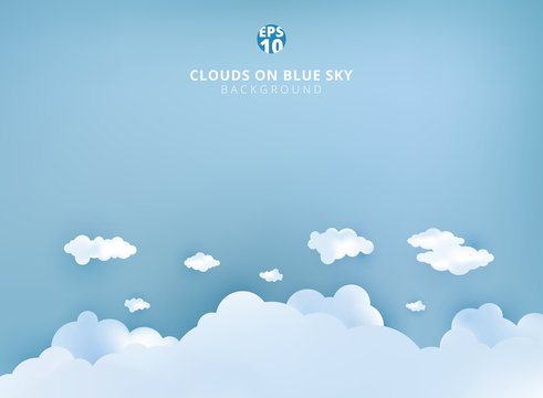 White clouds on pastel blue sky background design paper art and handicraft with copy space.