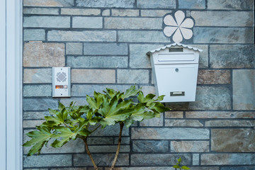 tin white mailbox on the wall 