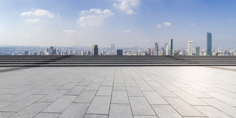 Fototapeta premium Panoramic skyline and modern business office buildings with empty road,empty concrete square floor