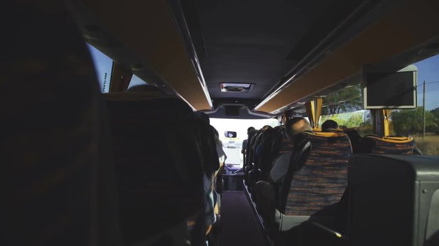 Back view of people sitting and driving in the car