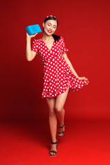 Pin up style girl listening old radio