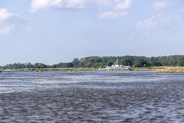 Greed-rope ferry is crossing the river
