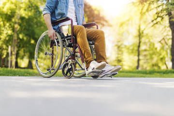Man in wheelchair - obrazy, fototapety, plakaty