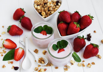 healthy breakfast, yogurt, fresh strawberries and granola