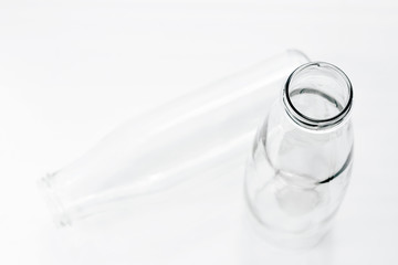 Two empty milk or kefir bottles of different shapes with copy space