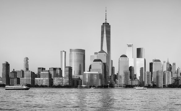 Black and white picture of Manhattan waterfront at sunset, New York City, USA.