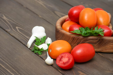 Tomatoes on wooden background