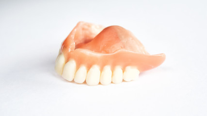 closeup of dental prosthesis on white background