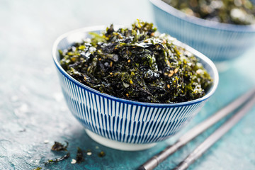 Crispy dried seaweed nori with sesame and sea salt. Asian cuisine - obrazy, fototapety, plakaty