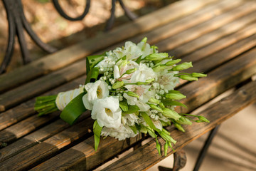 bouquet on wooden bench