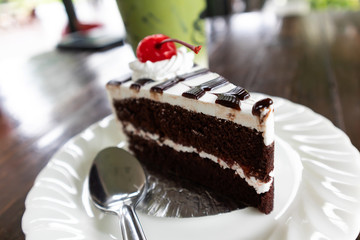 Delicious Chocolate cake and  sherry in white plate
